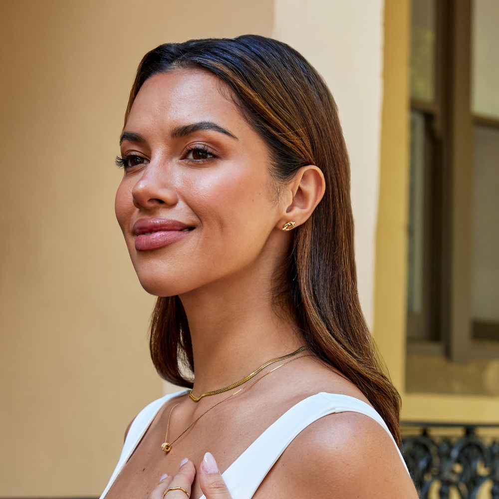 Romana – Cercei din aur cu formă împletită.